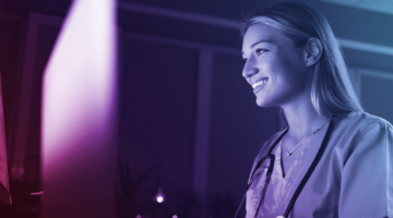 Nurse working on computer at night.