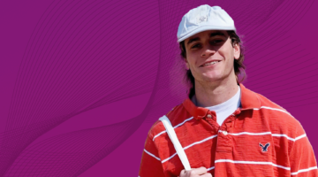 Young Man with a hat smiling.