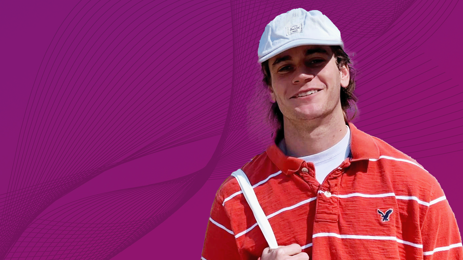 Young Man with a hat smiling.