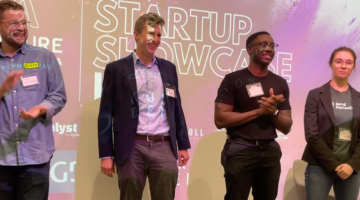 Four founders at the showcase reveal stage.