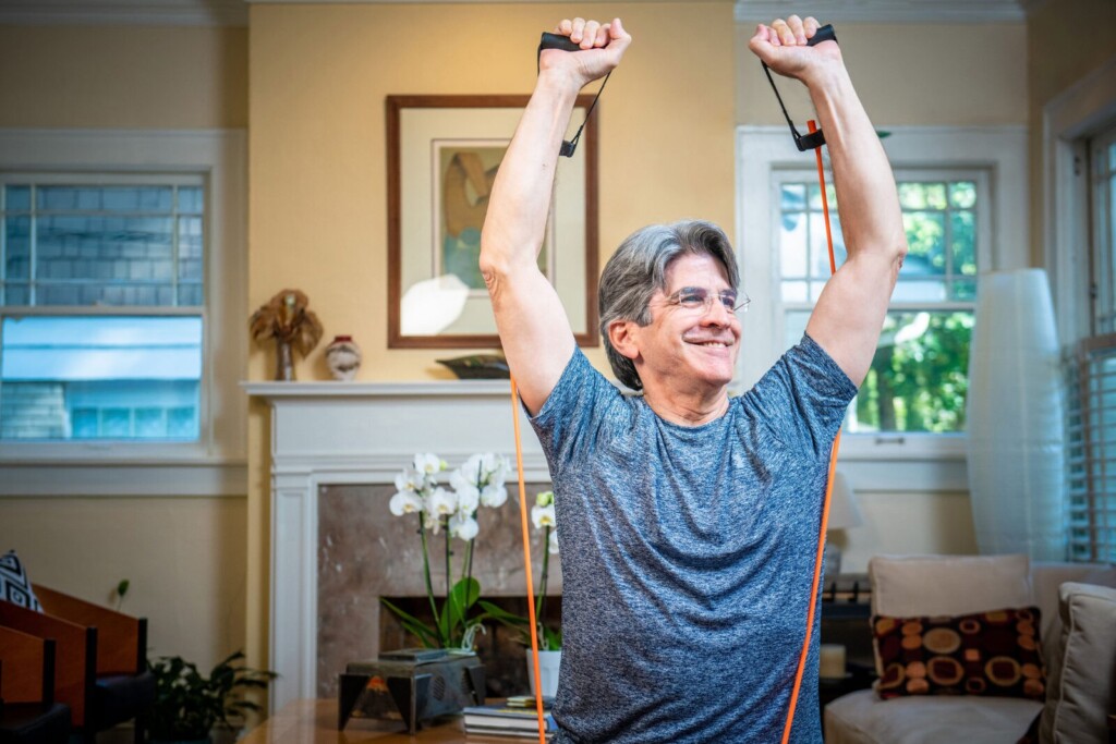 Senior working out at home.