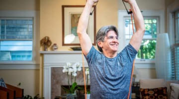 Senior working out at home.